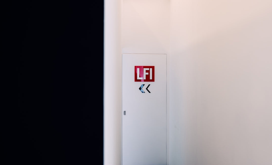 A white cabinet features lfi and arrows.
