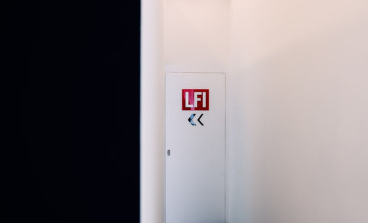 A white cabinet features lfi and arrows.