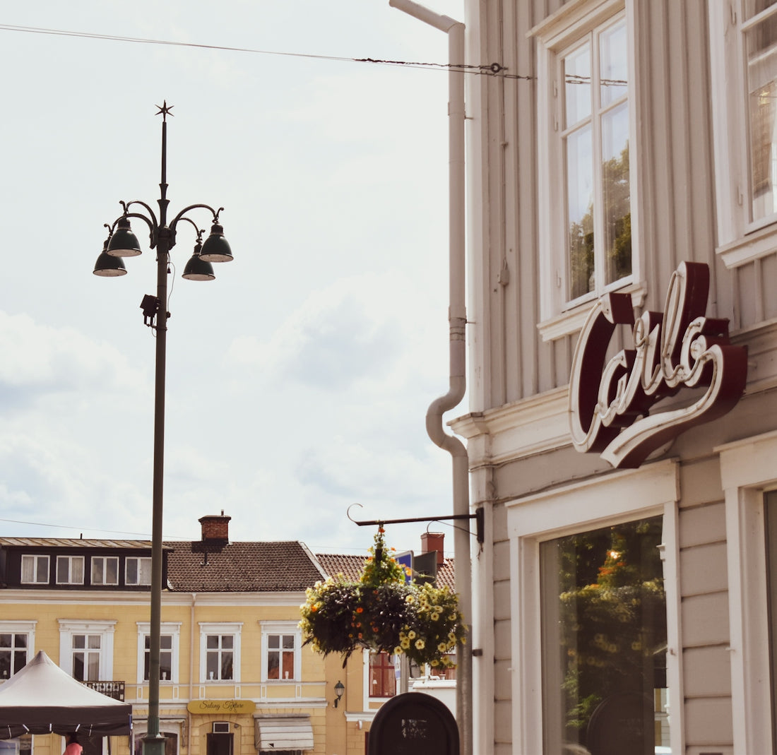 white and brown concrete building under white clouds during daytime