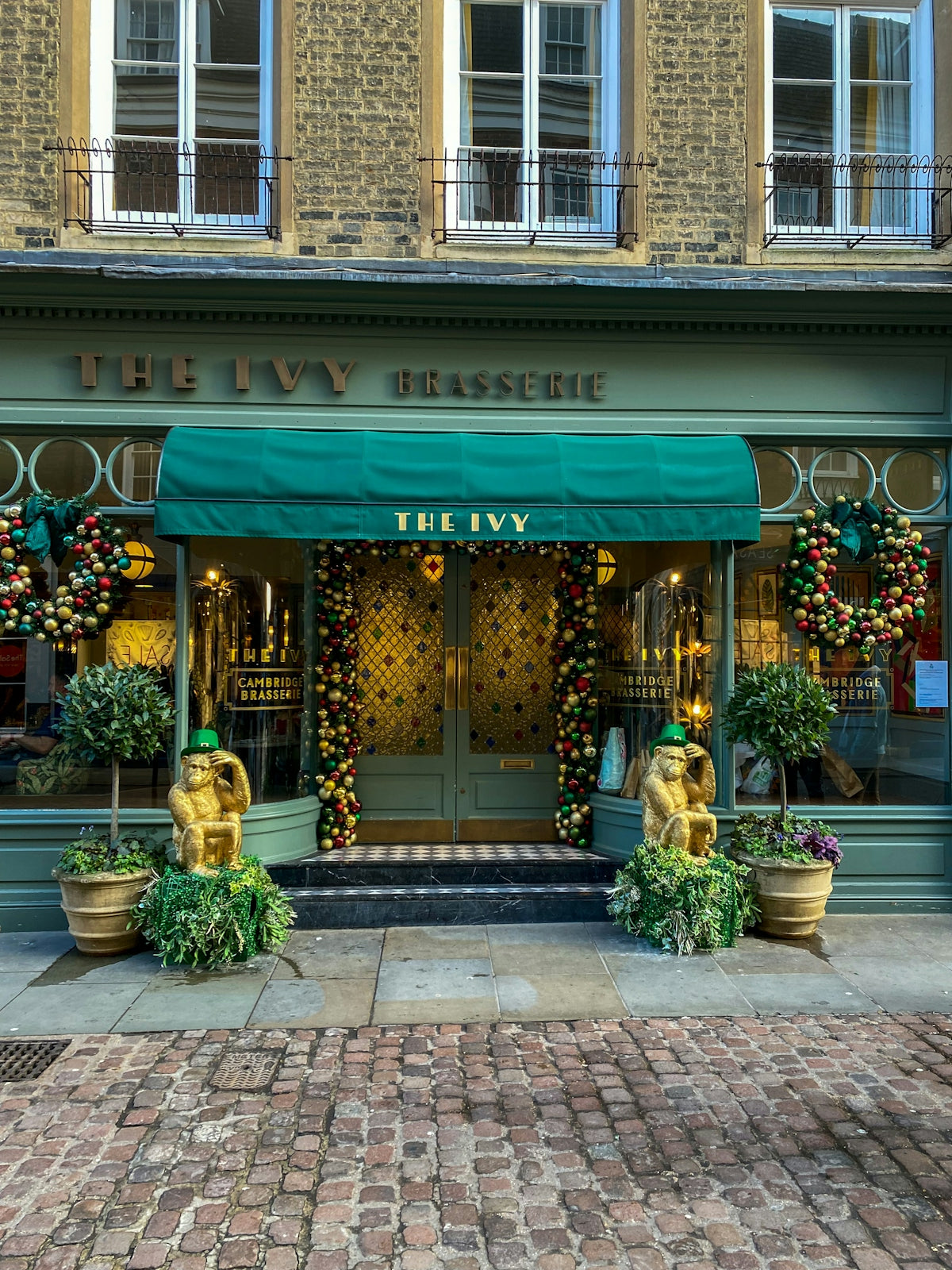 a store front with a green awning