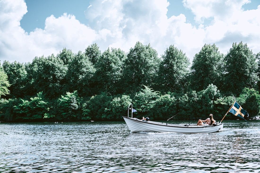 Two people in a row boat on a lake