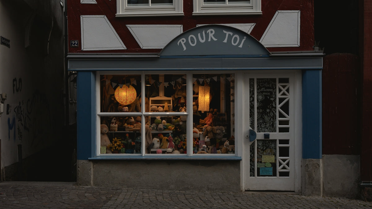A cozy shopfront with warm lighting.