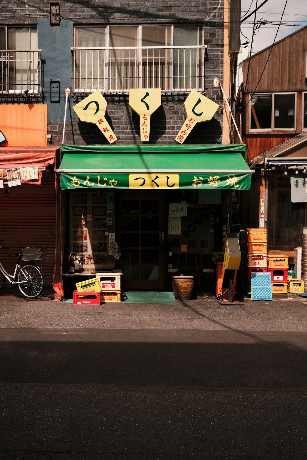 An izakaya restaurant with a green awning in the Asakusa district of Taito City